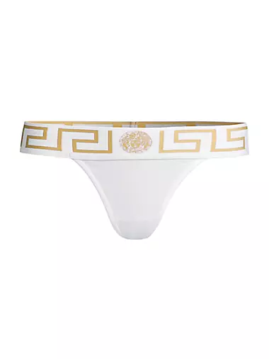 Premium Photo  Golden satin women's underwear on a white background