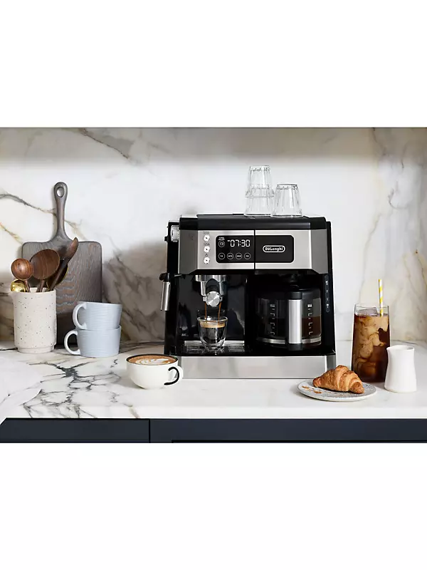 Premium Photo  Making coffee at home with an espresso machine frozen  coffee movement.