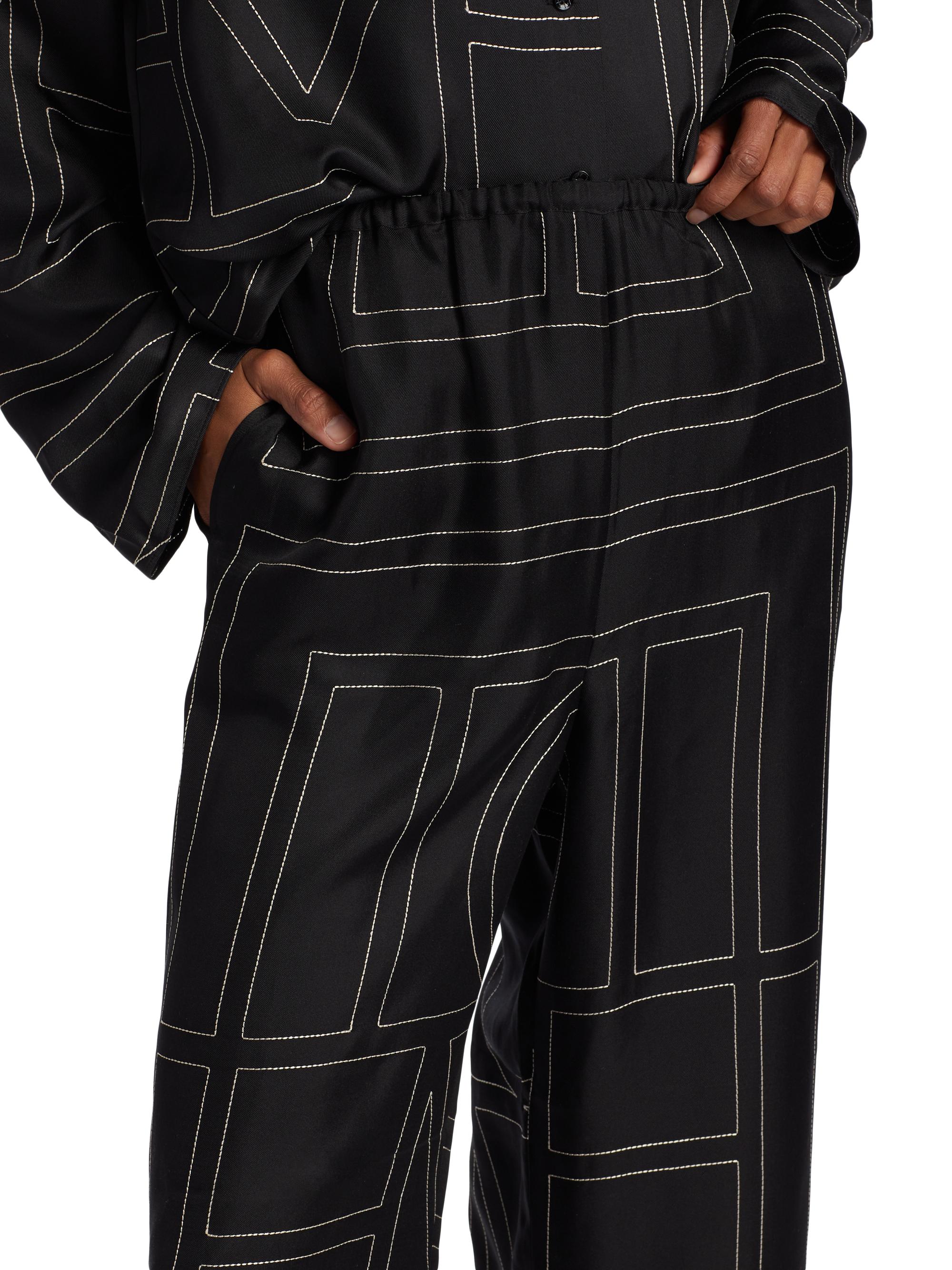 Shop Toteme Monogram Stitch Silk Pants | Saks Fifth Avenue
