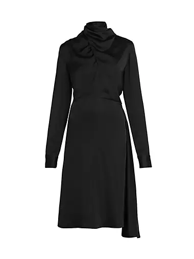 Jil Sander Milan Ready to Wear Spring Summer All black, long coat over high  neck skintight dress with black footless tights Stock Photo - Alamy