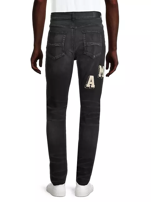Shop Amiri Distressed Varsity Logo Jeans | Saks Fifth Avenue