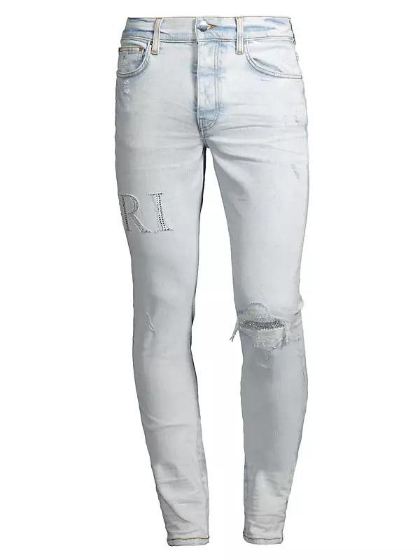 Shop Amiri Crystal Logo Distressed Jeans | Saks Fifth Avenue