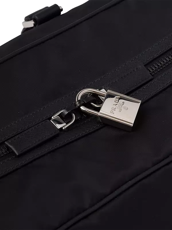 PRADA: duffle bag in technical nylon with triangular logo - Black