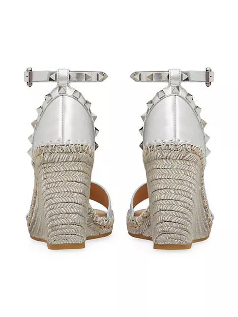 Shop Valentino Garavani Rockstud Double Wedge Sandals in Metallic
