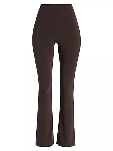 High-rise faux leather flared leggings in brown - Norma Kamali