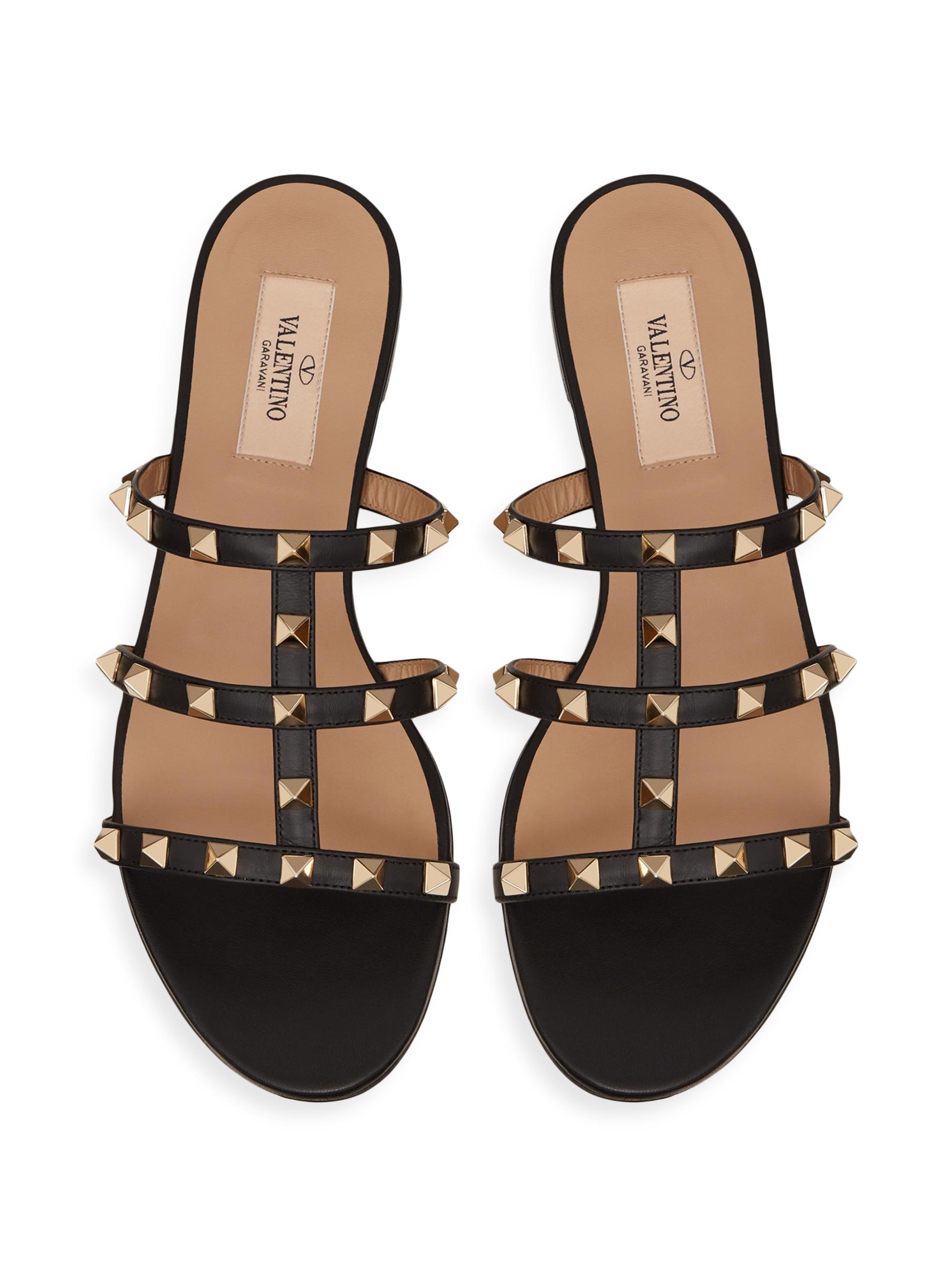 Valentino Garavani Rockstud Flat Slide Sandals | Saks Fifth Avenue