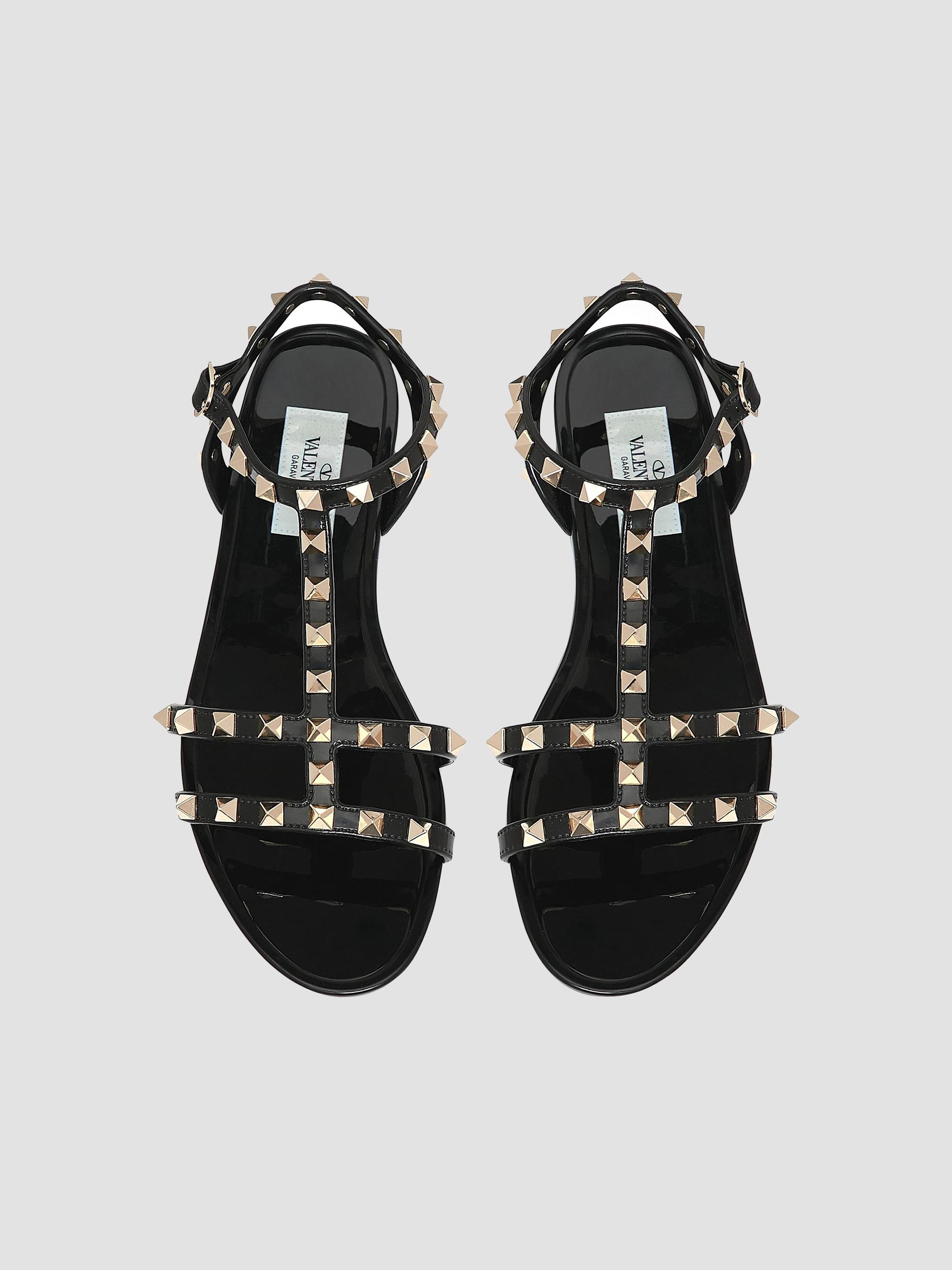 Valentino Garavani Rockstud Flat Rubber Sandals | Saks Fifth  display picture 1