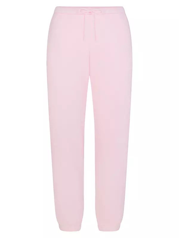 Kim Kardashian wearing skims pink pajamas click to shop