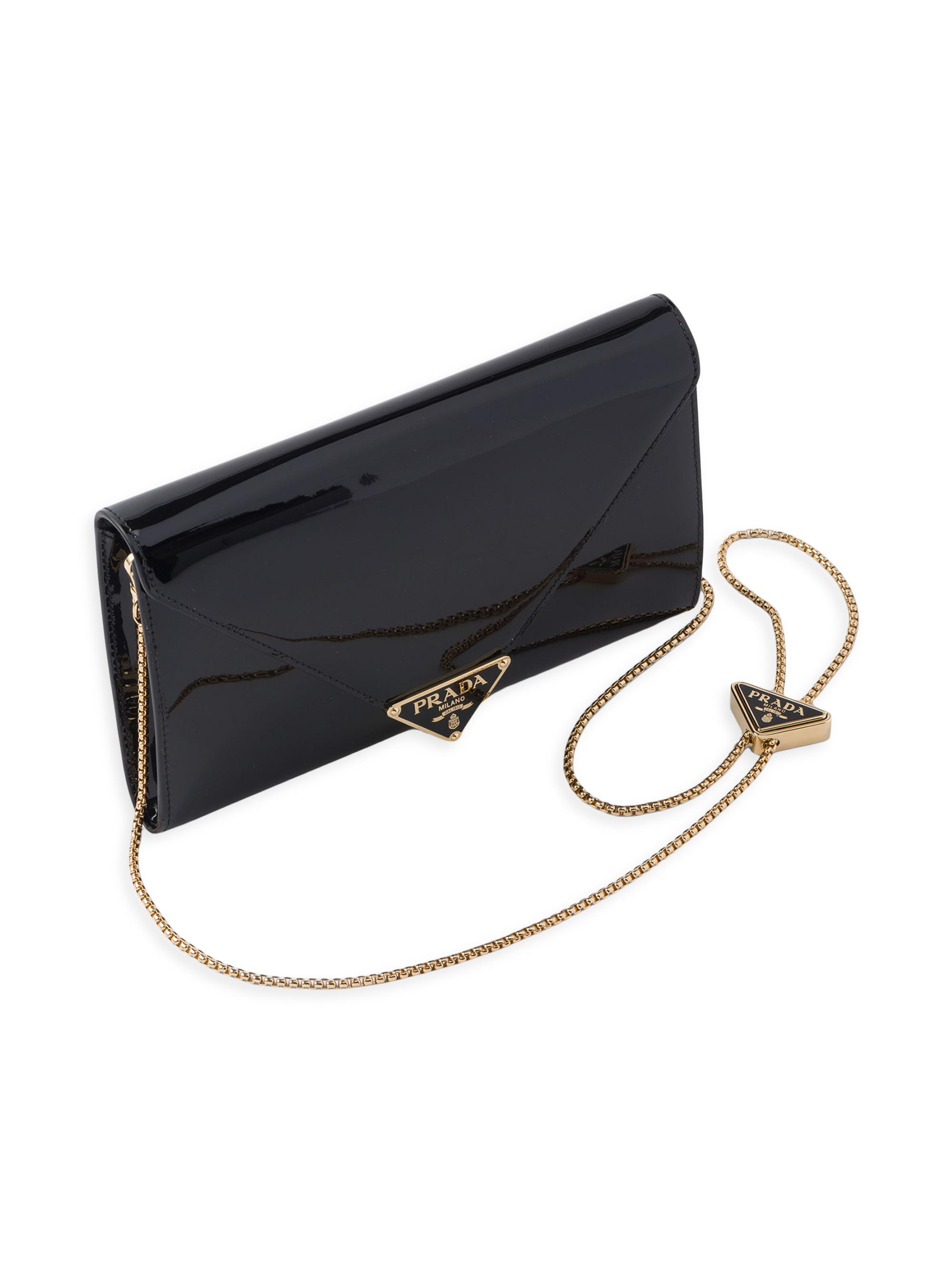 バッグ PRADA PATENT LEATHER FLAP HAND BAG Logo patent leather shoulder bag in black - Prada | Mytheresa
