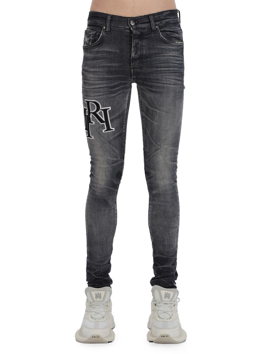 Amiri Staggered Logo Skinny Jeans | Saks Fifth Avenue