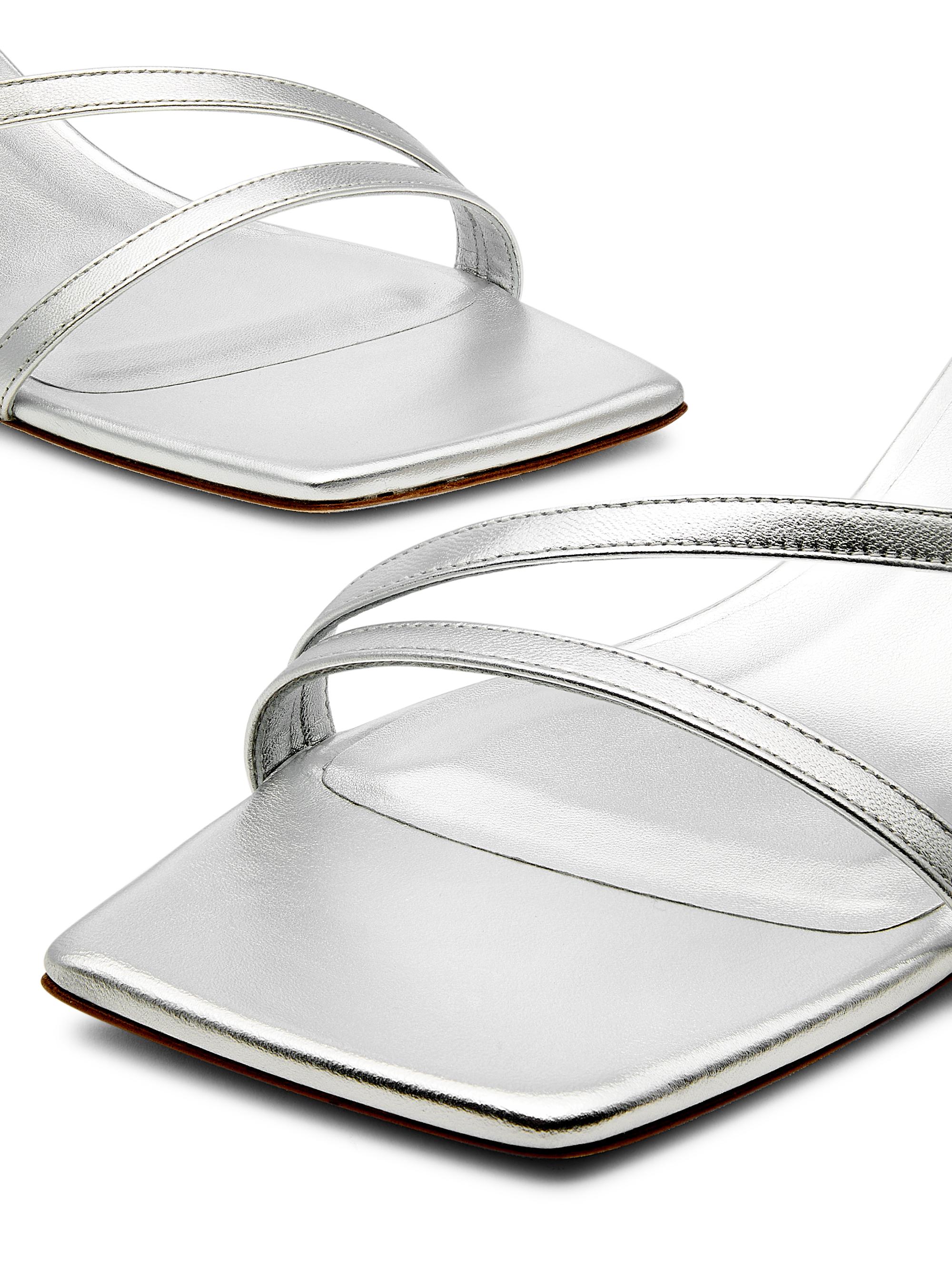 Stuart Weitzman Oasis 50MM Metallic Leather Sandals | Saks