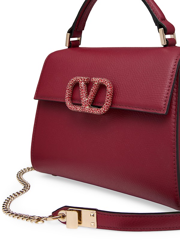 Shop Valentino Garavani VSling Mini Top Handbag with Logo Shop Valentino Garavani VSling Mini Top Handbag with Logo