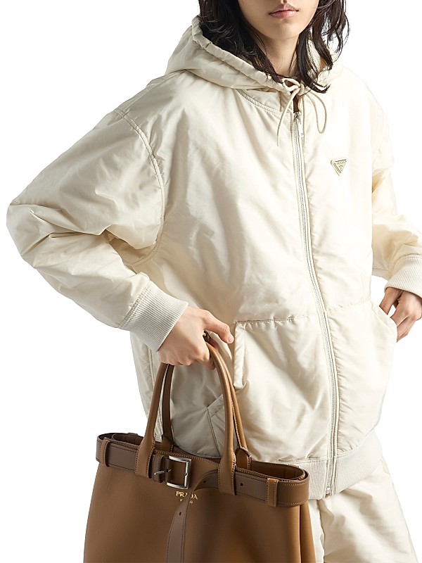Shop Prada Lightweight Hooded Nylon Blouson Jacket | Saks Shop Prada Lightweight Hooded Nylon Blouson Jacket | Saks