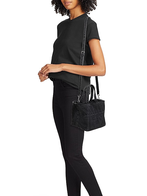 Shop Alexander Wang Small Punch Logo Denim Tote Bag | Saks Shop Alexander Wang Small Punch Logo Denim Tote Bag | Saks