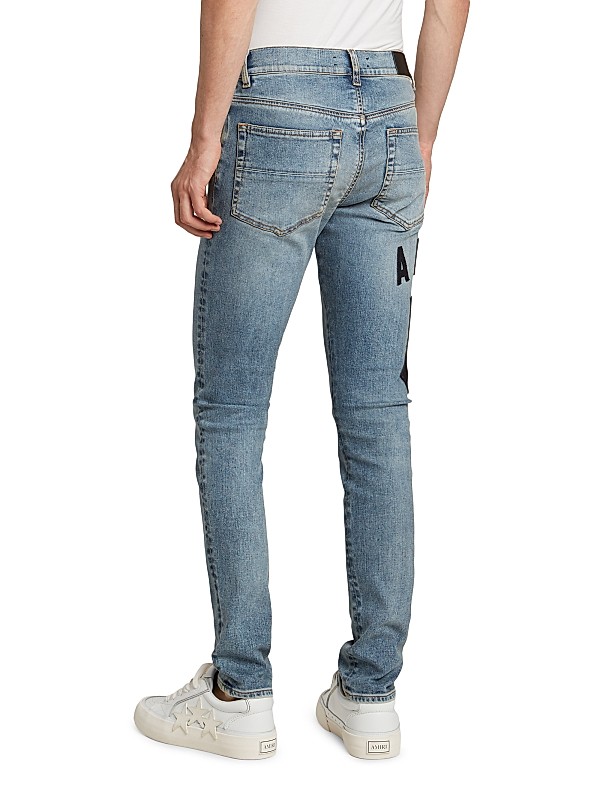 Shop Amiri Suede Appliqué Logo Skinny Jeans | Saks Fifth Avenue Shop Amiri Suede Appliqué Logo Skinny Jeans | Saks Fifth Avenue