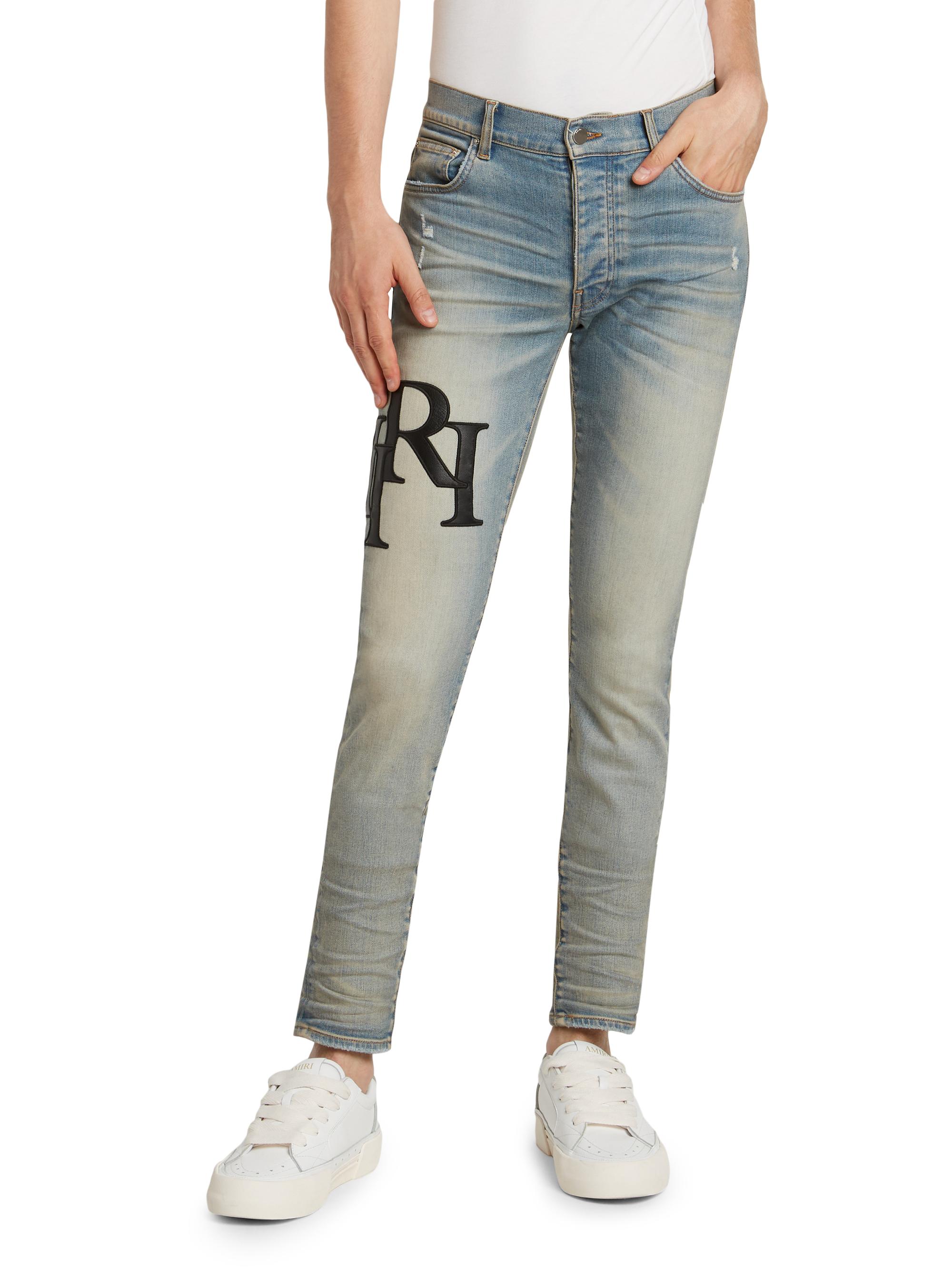 Amiri Staggered Logo Skinny Jeans | Saks Fifth Avenue