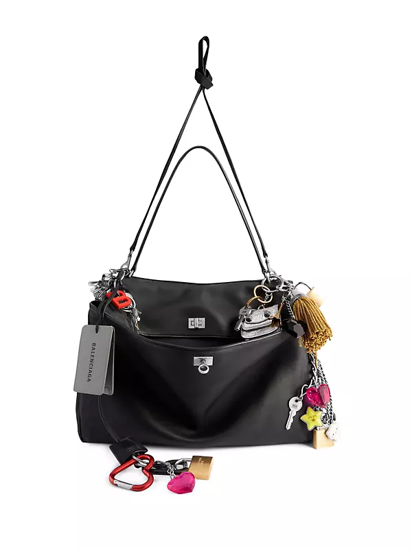 Shop Balenciaga Rodeo Used Effect Large Handbag with Charms Shop Balenciaga Rodeo Used Effect Large Handbag with Charms