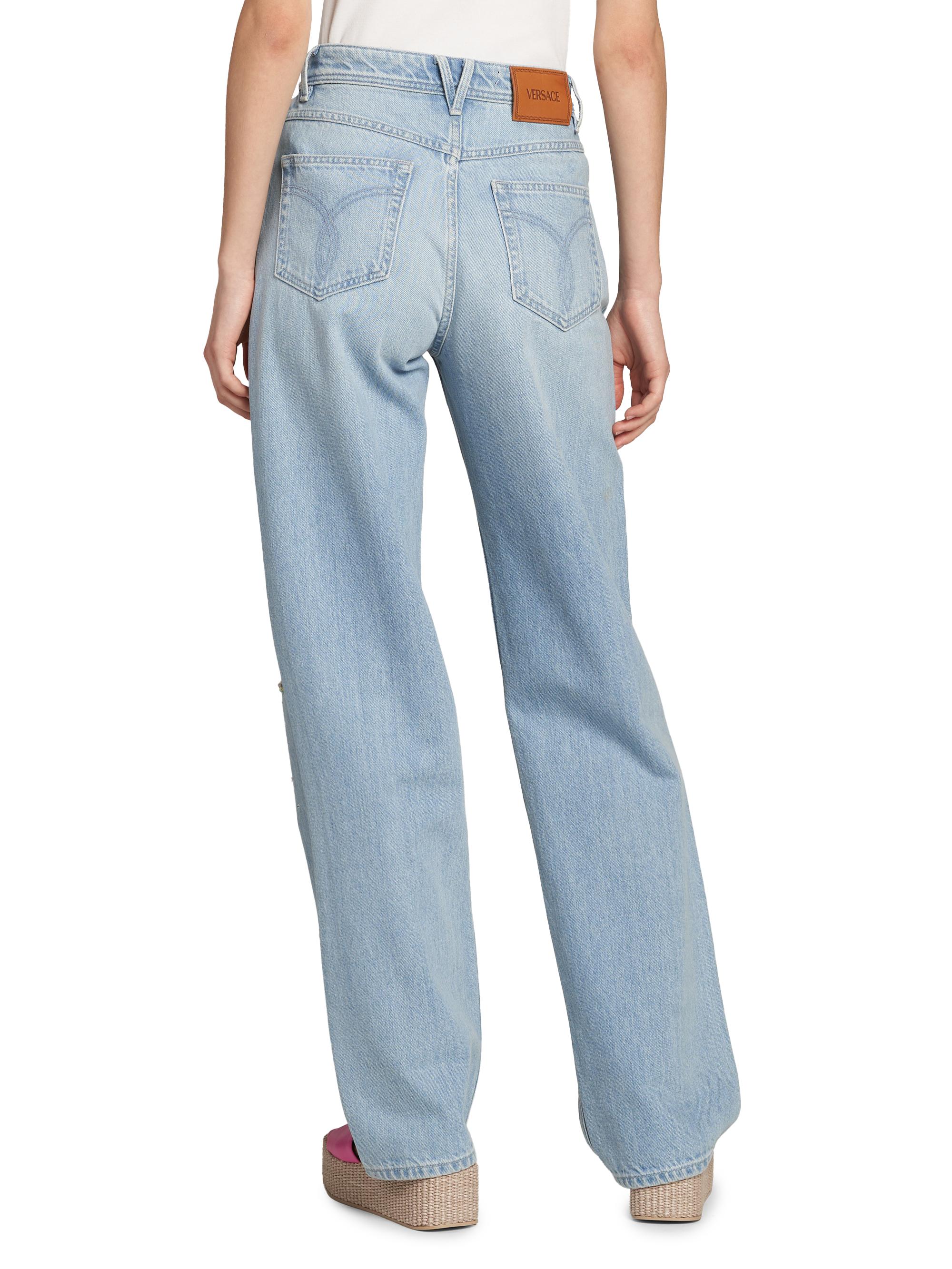 Versace Embroidered Washed Cotton Jeans | Saks Fifth Avenue