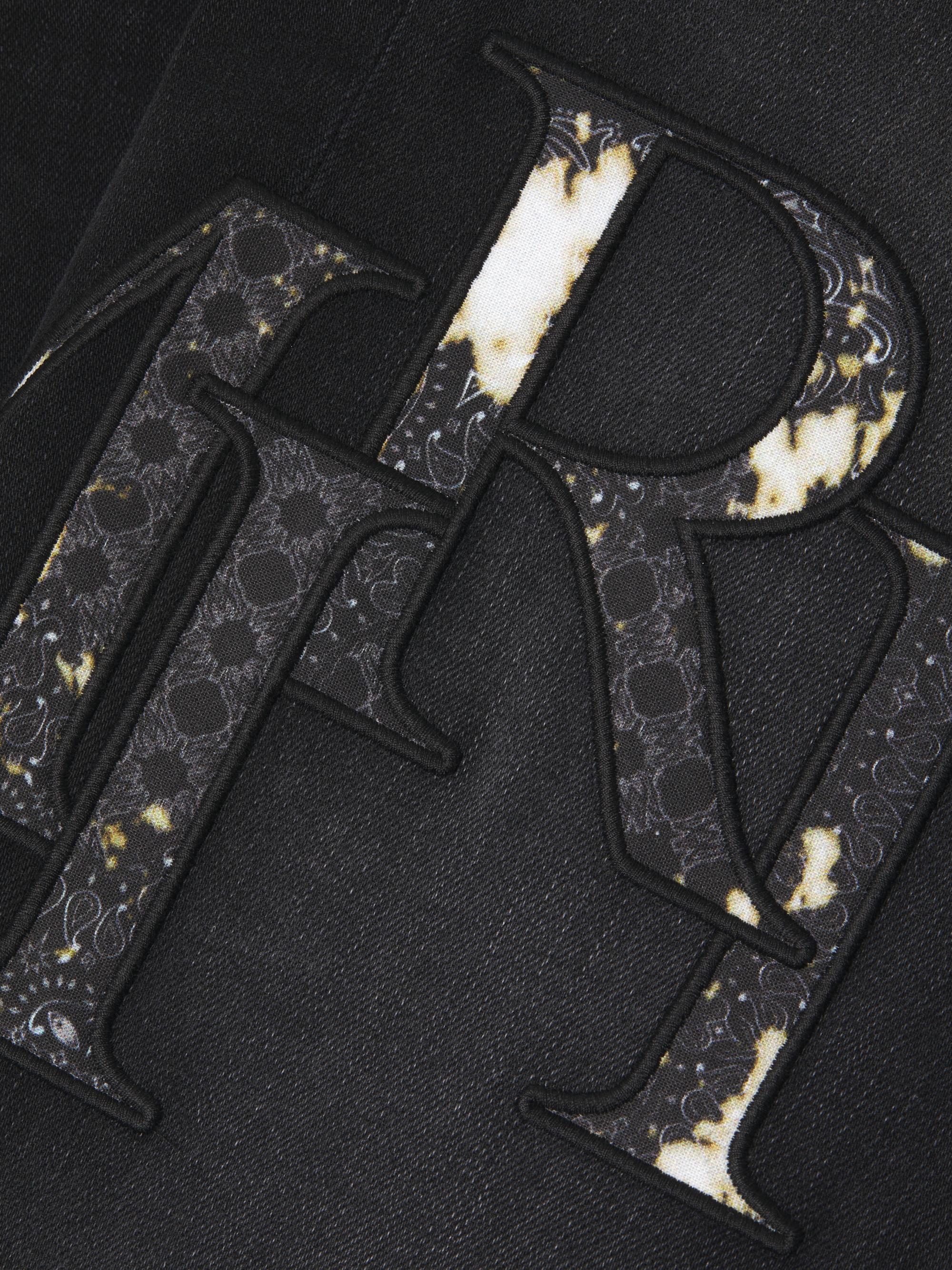 Amiri Staggered Logo Skinny Jeans | Saks Fifth Avenue