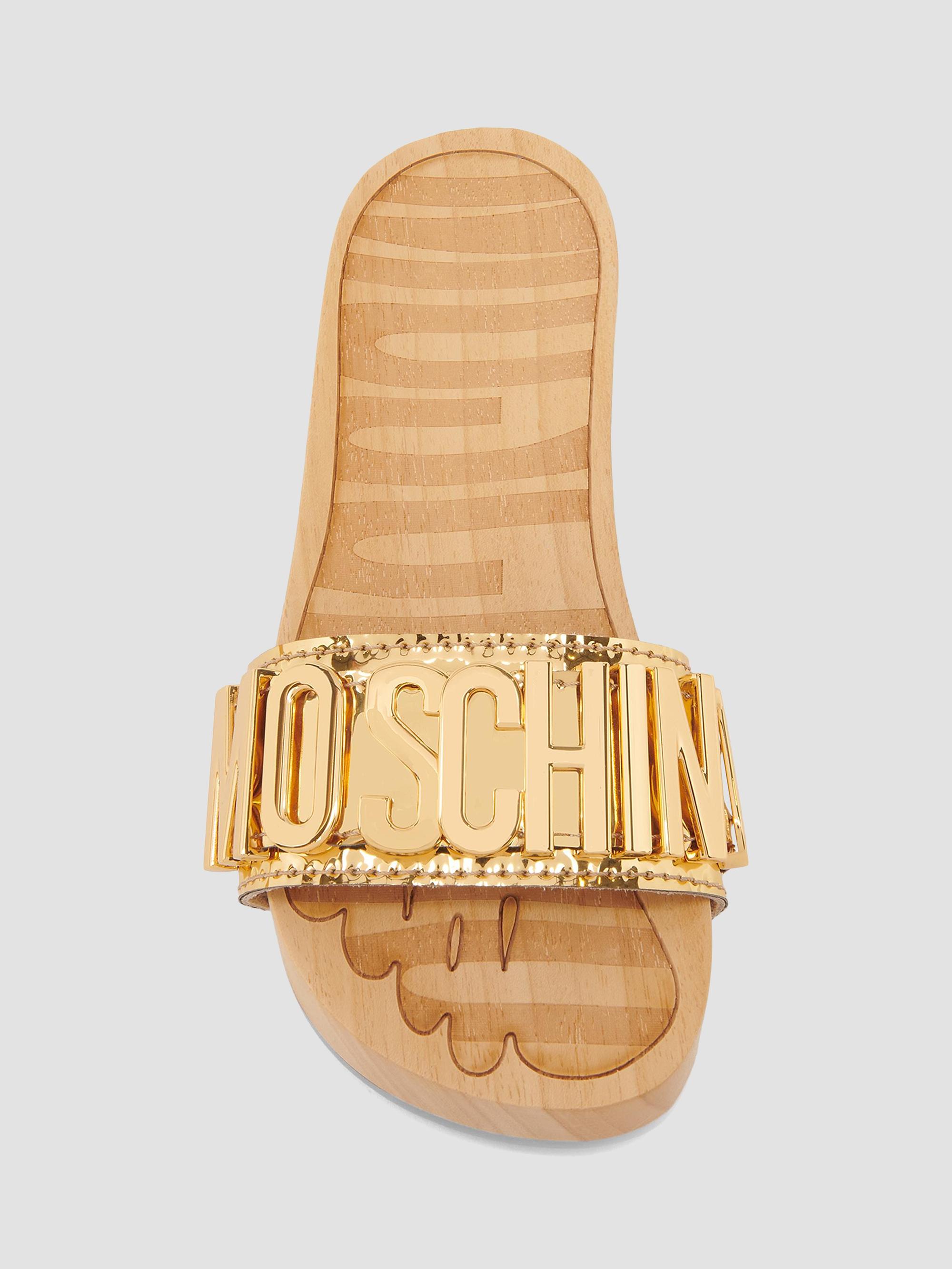 Moschino 45MM Logo & Buckle Chrome Mule Slides | Saks Fifth Avenue