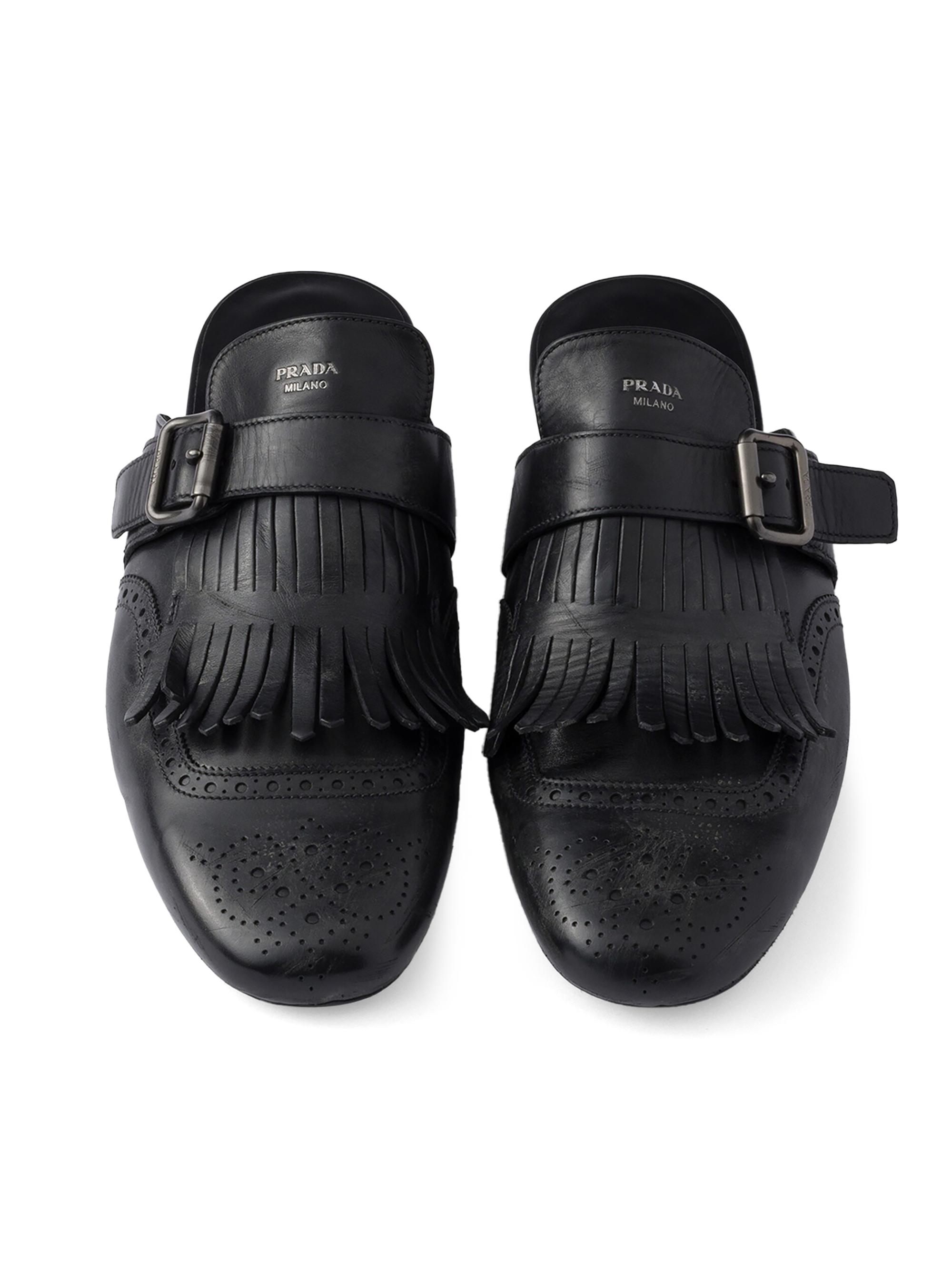 Prada Shuffle Antiqued Leather Mules with Buckled Strap and Fringe