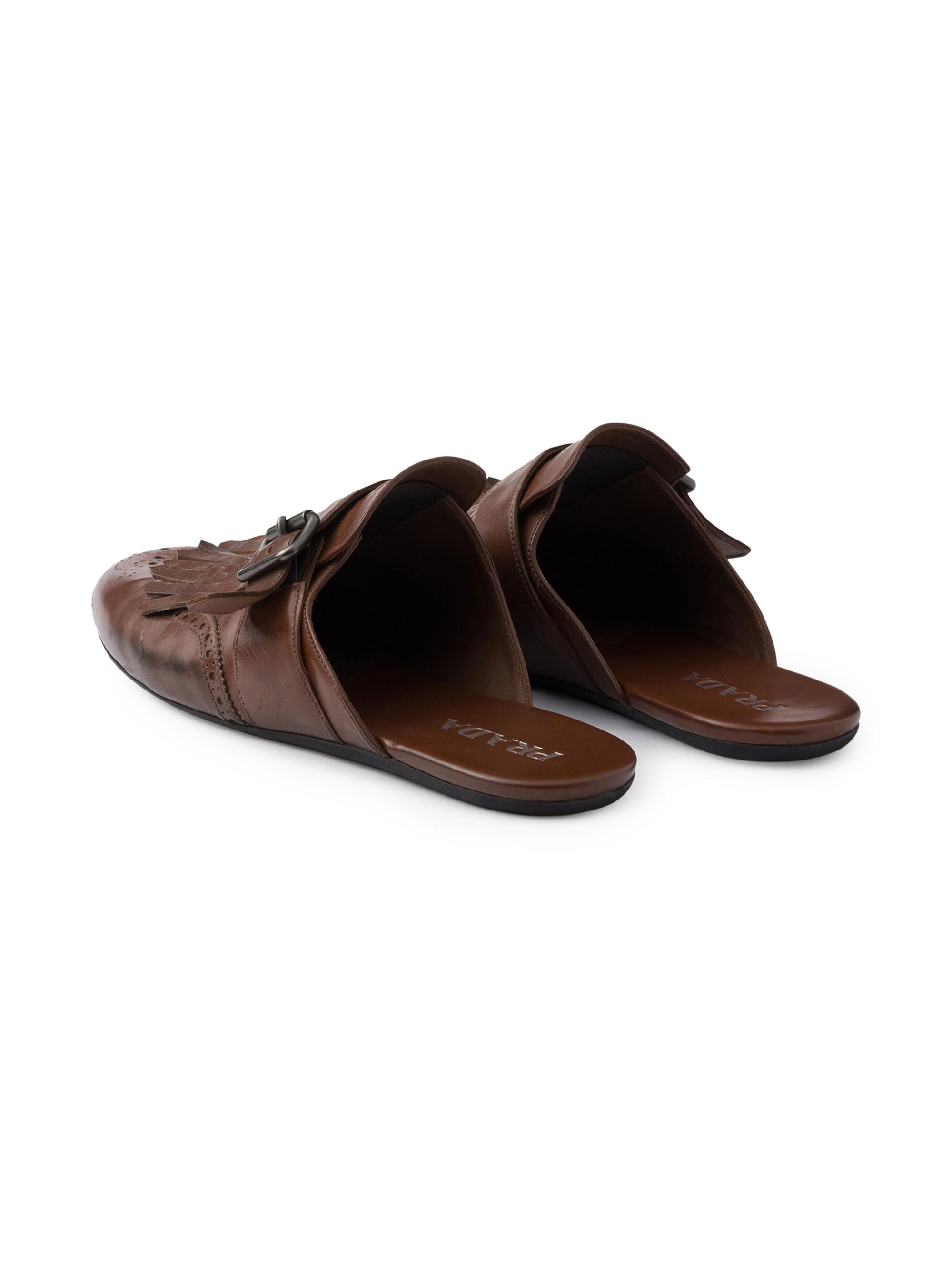 Prada Shuffle Antiqued Leather Mules with Buckled Strap and Fringe