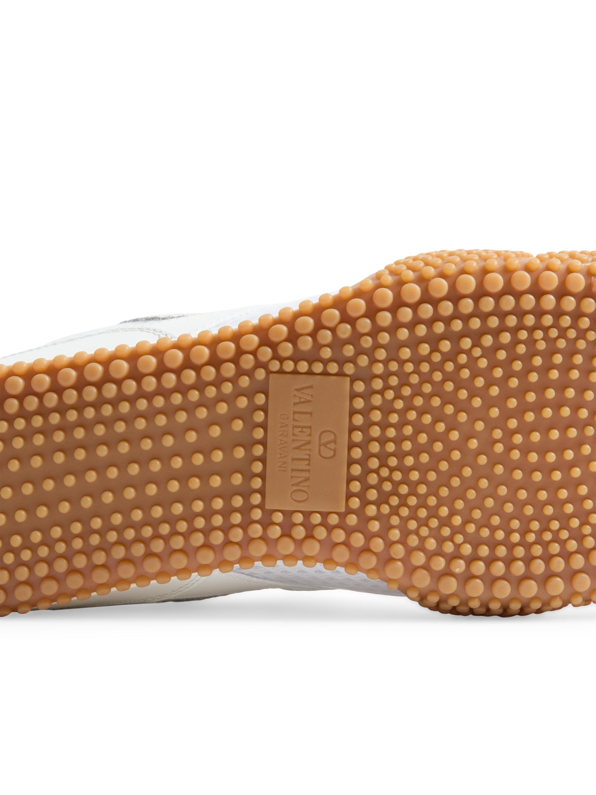 Valentino Garavani Amphibia Sneakers in Rubberized Calfskin and